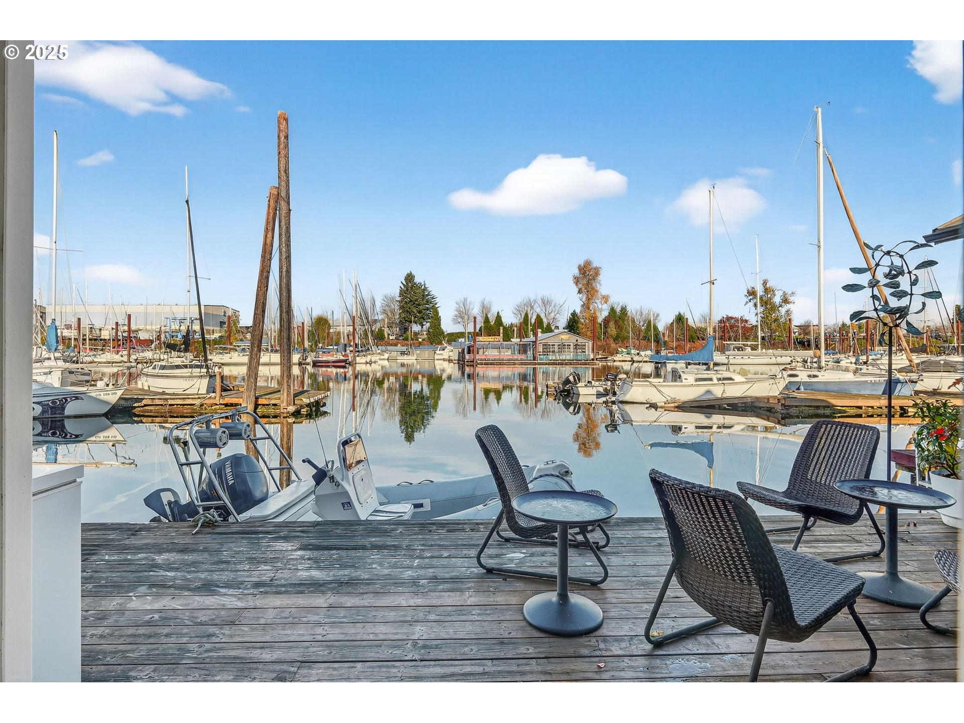 173 Northeast Bridgeton Road, Unit 13 Portland, OR 97211 - Photo 22 of 22 a view of a chairs and table on the terrace