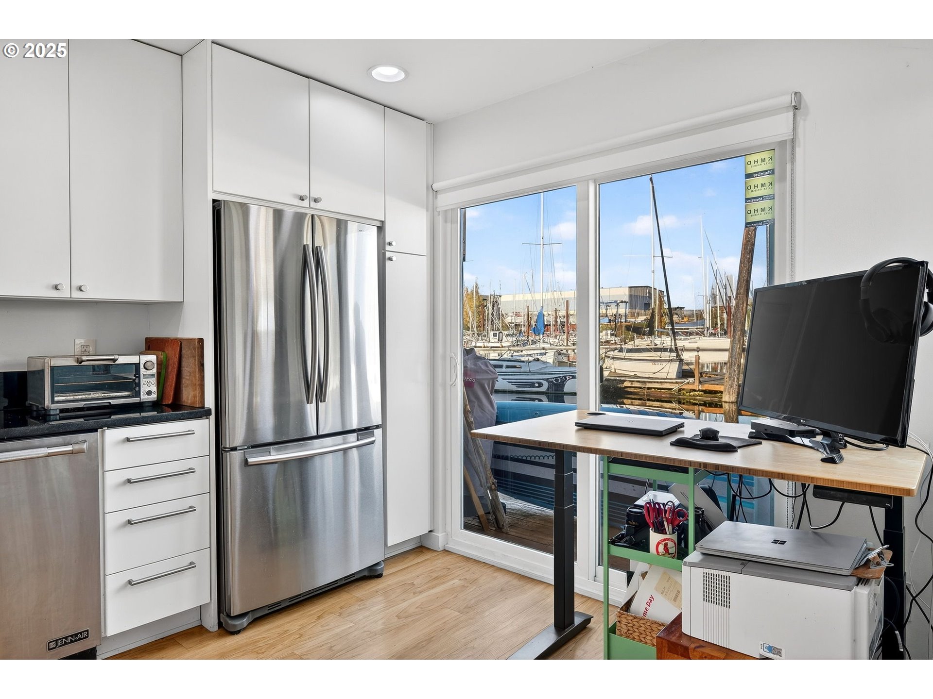 173 Northeast Bridgeton Road, Unit 13 Portland, OR 97211 - Photo 7 of 22 a kitchen with stainless steel appliances granite countertop a refrigerator and a stove top oven