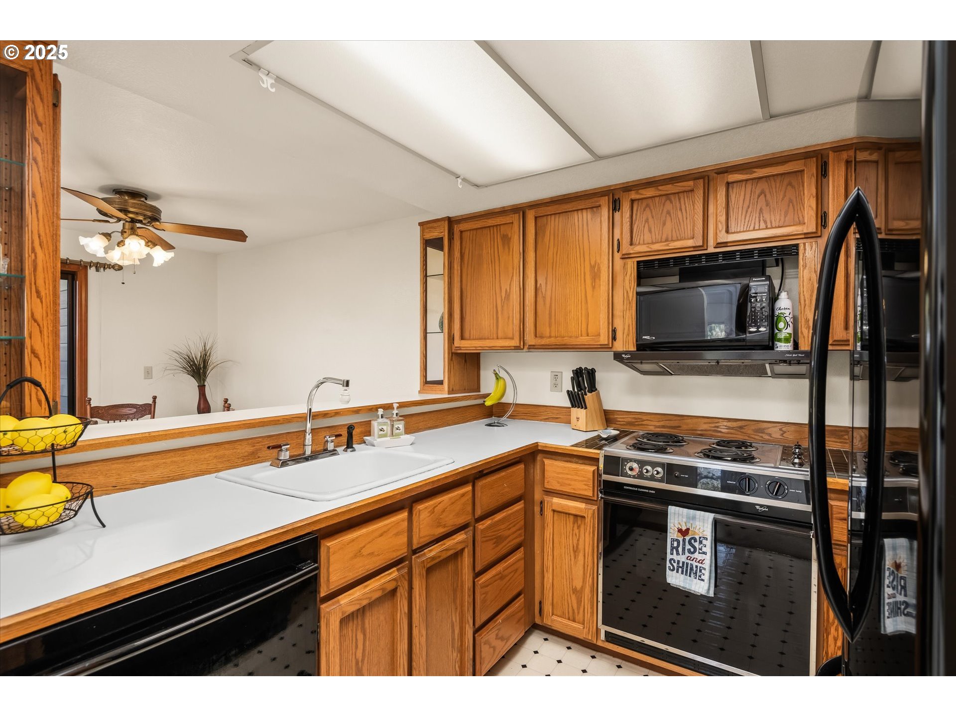 2095 Lake Isle Drive Eugene, OR 97401 - Photo 14 of 32 a kitchen with stainless steel appliances a sink dishwasher stove and microwave