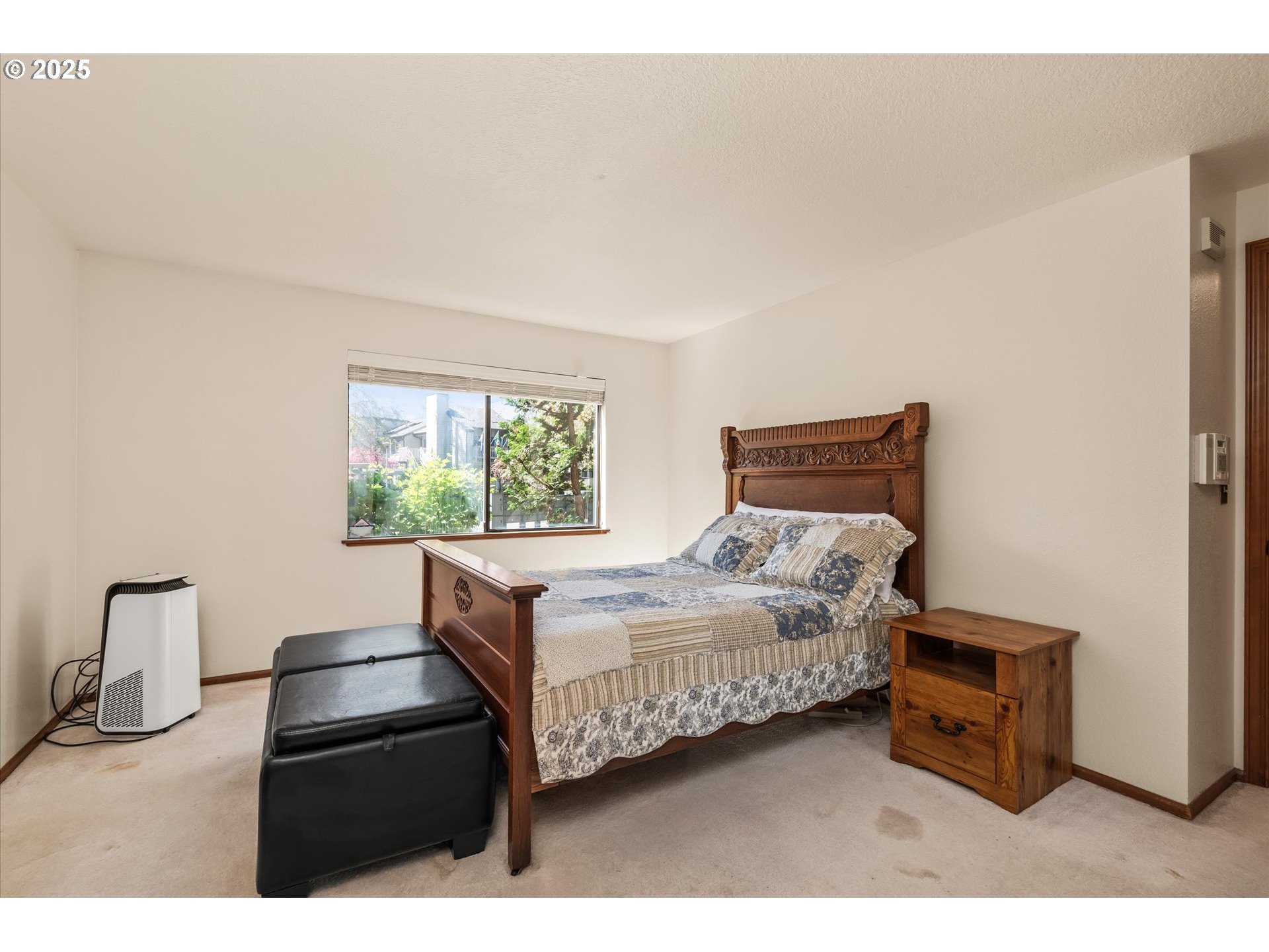 2095 Lake Isle Drive Eugene, OR 97401 - Photo 17 of 32 a bedroom with a bed and a night stand