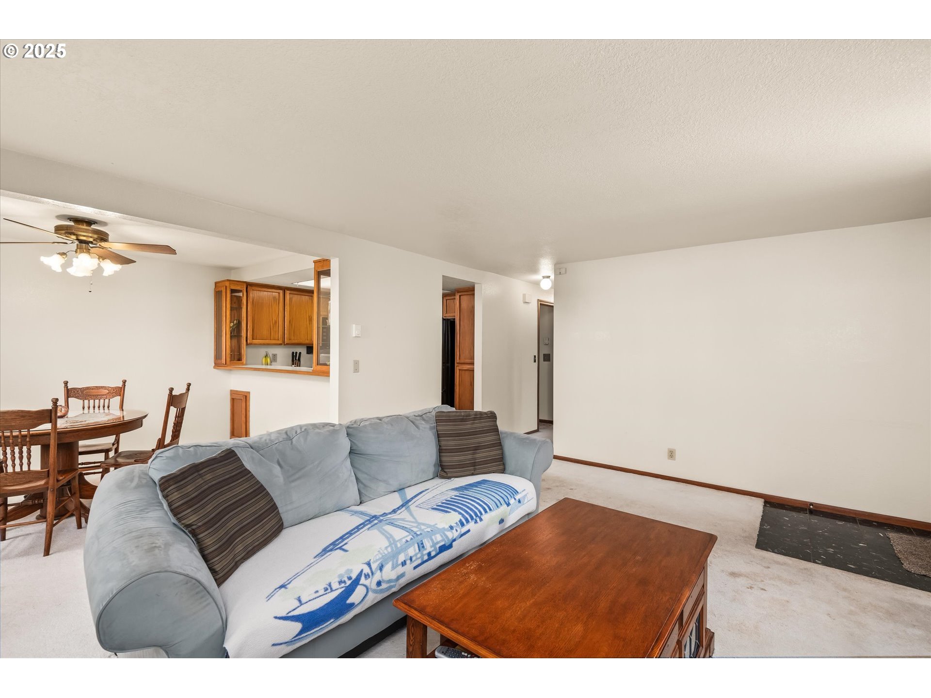 2095 Lake Isle Drive Eugene, OR 97401 - Photo 5 of 32 a living room with furniture and a flat screen tv