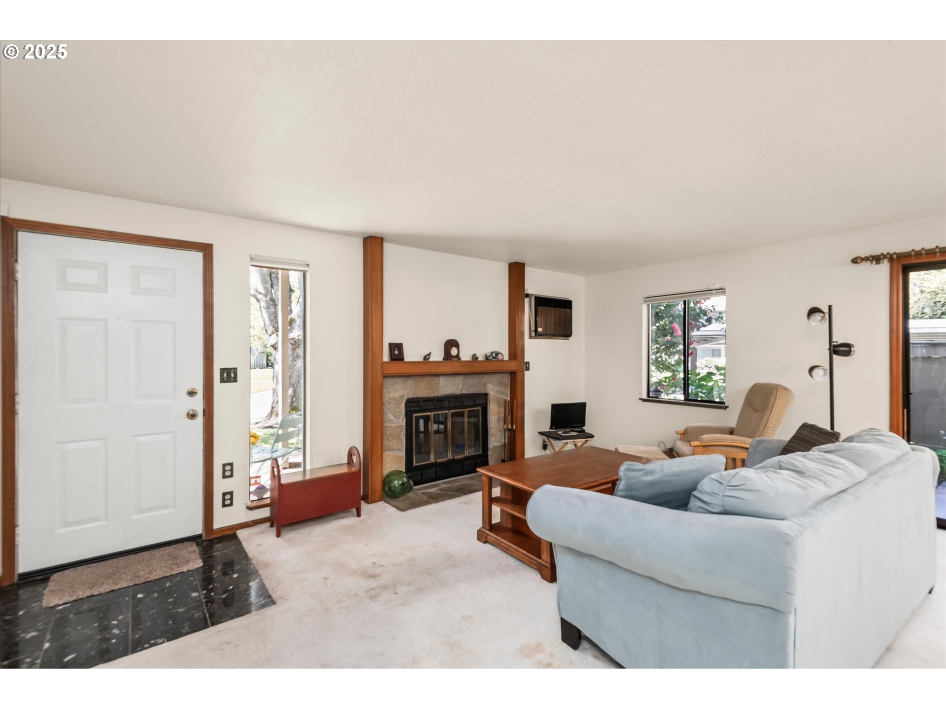 2095 Lake Isle Drive Eugene, OR 97401 - Photo 6 of 32 a living room with furniture and a fireplace