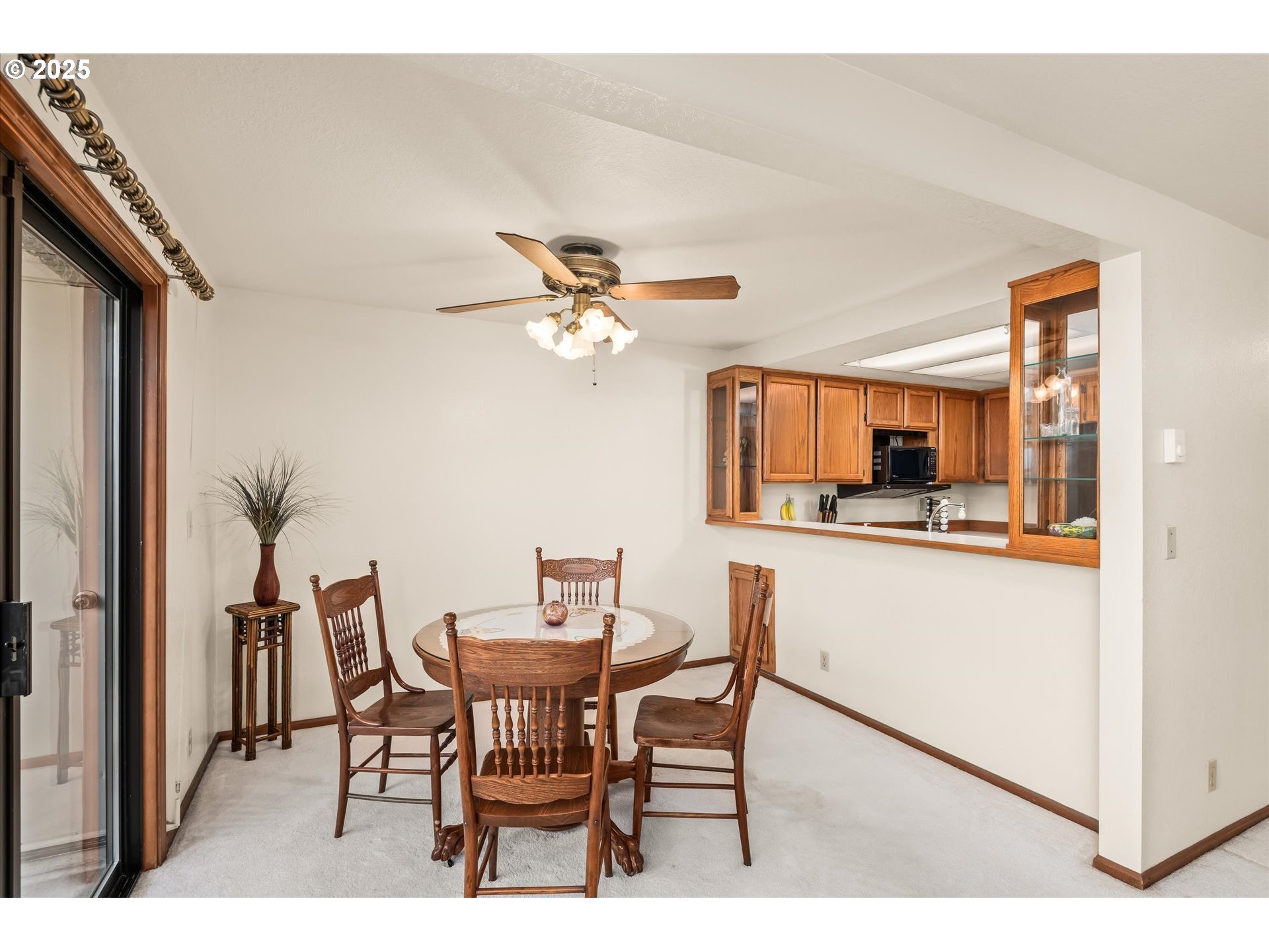 2095 Lake Isle Drive Eugene, OR 97401 - Photo 9 of 32 a view of a dining room with furniture and chandelier