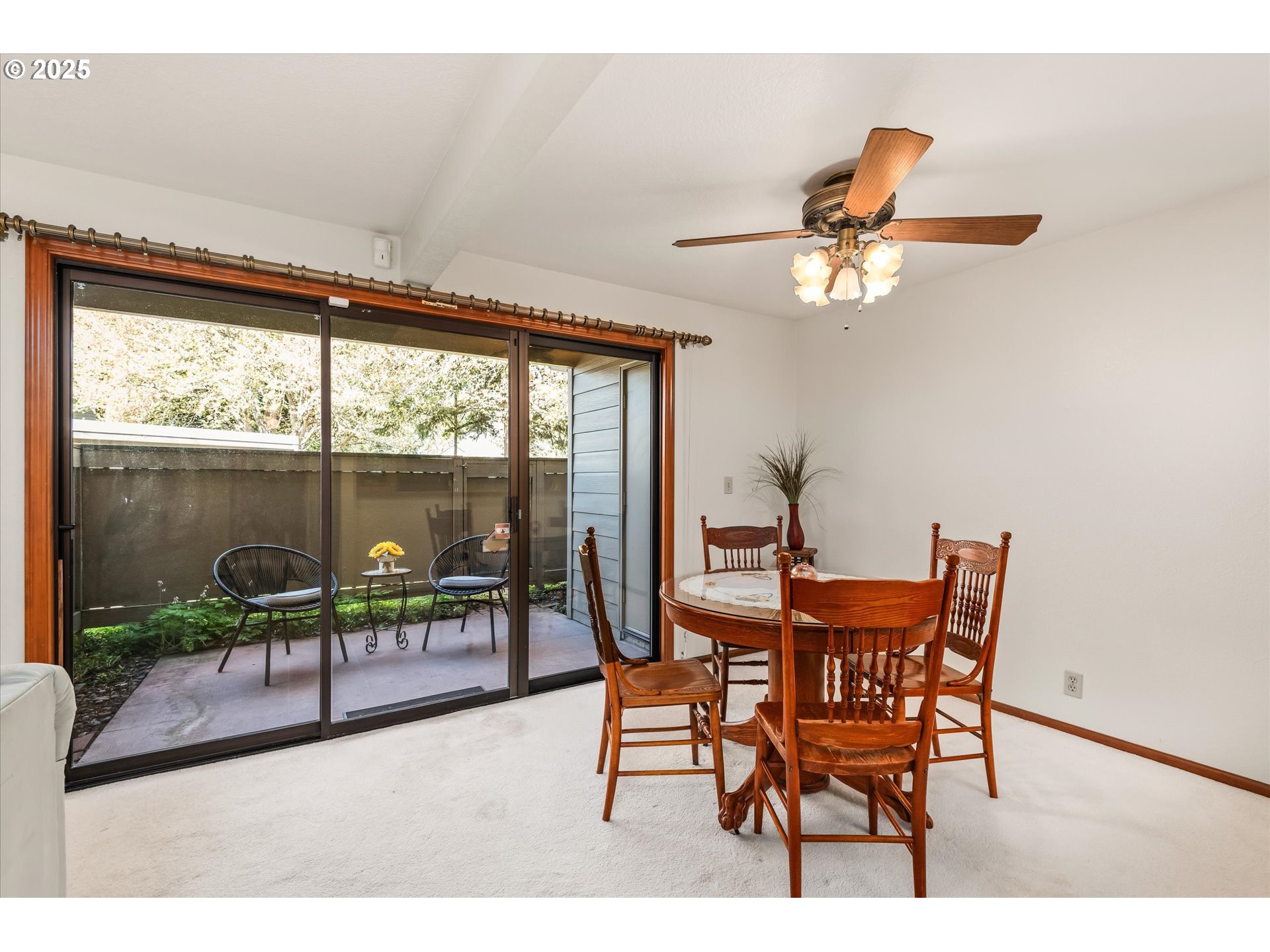2095 Lake Isle Drive Eugene, OR 97401 - Photo 10 of 32 a dining room with furniture and a floor to ceiling window