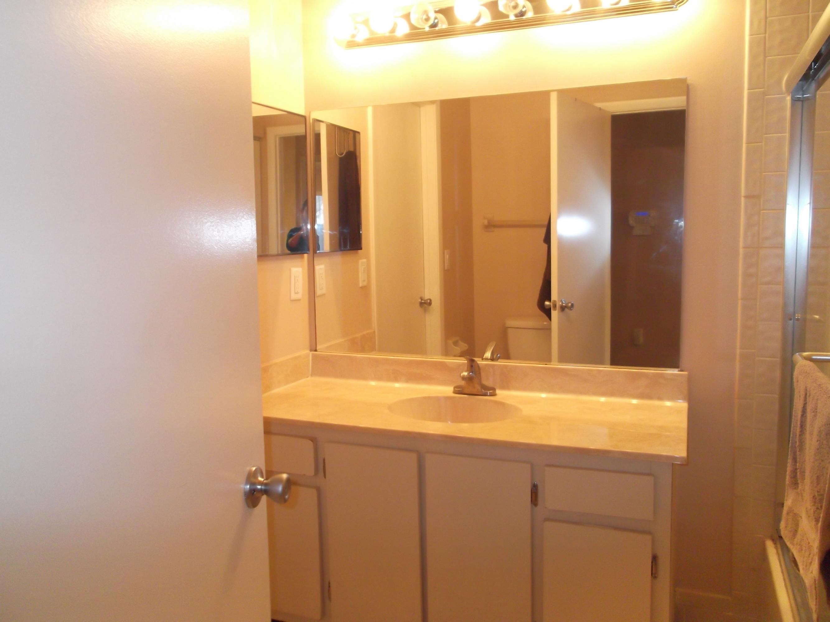 9665 Golf State Park Way Boca Raton, FL 33428 - Photo 11 of 22 a bathroom with a sink and a mirror