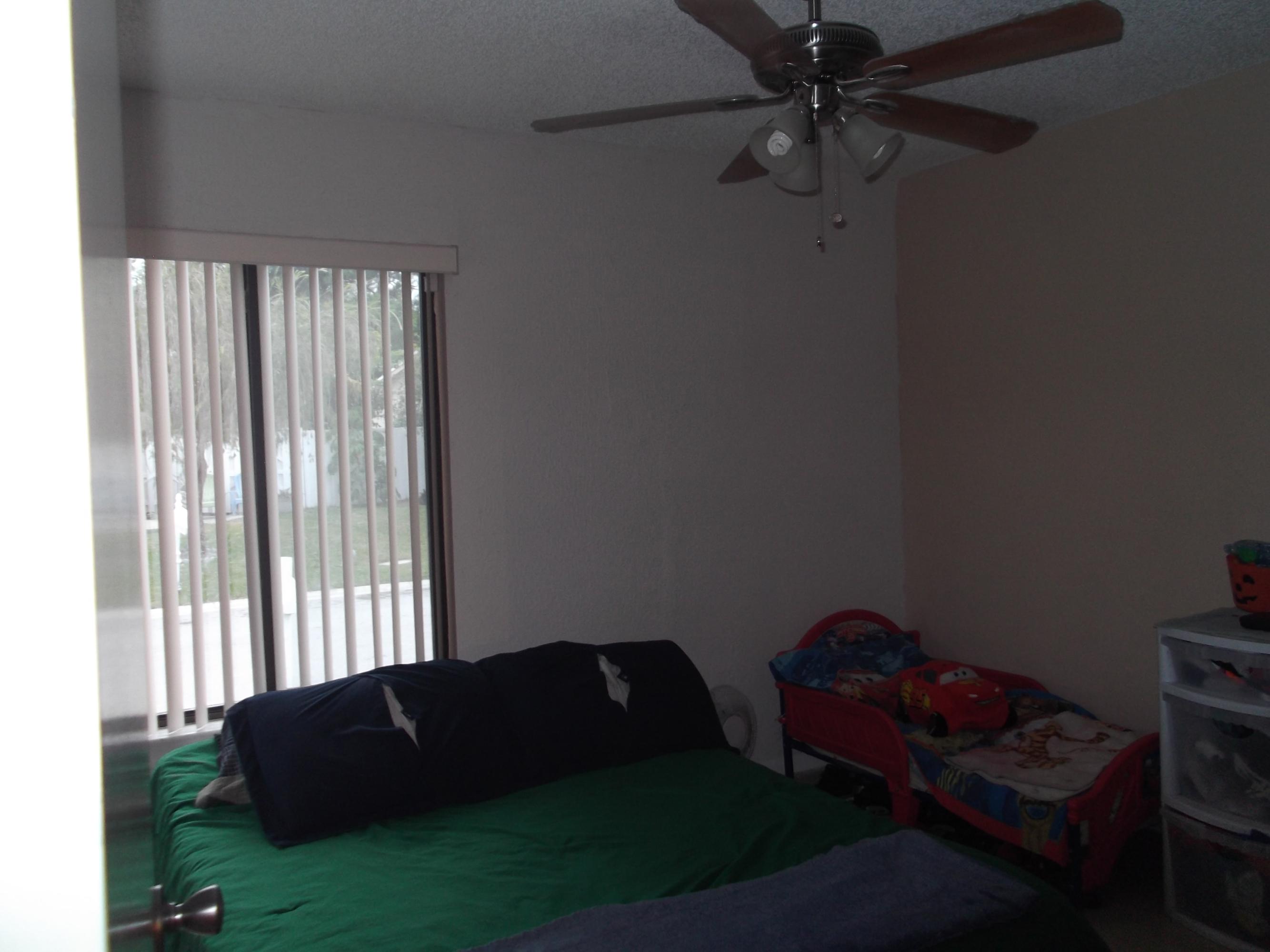 9665 Golf State Park Way Boca Raton, FL 33428 - Photo 12 of 22 a living room with furniture and a window