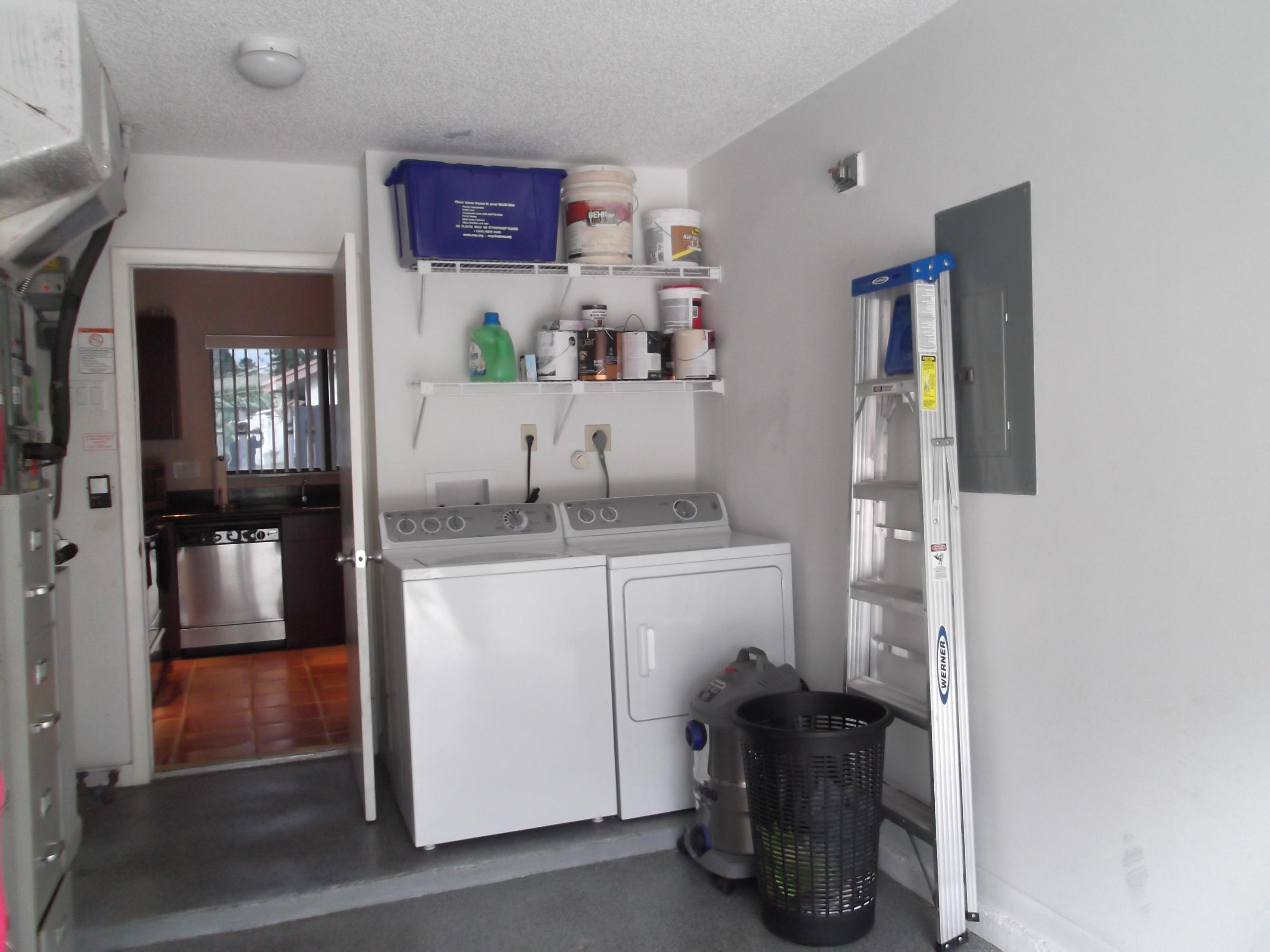 9665 Golf State Park Way Boca Raton, FL 33428 - Photo 14 of 22 a kitchen with a refrigerator and countertop