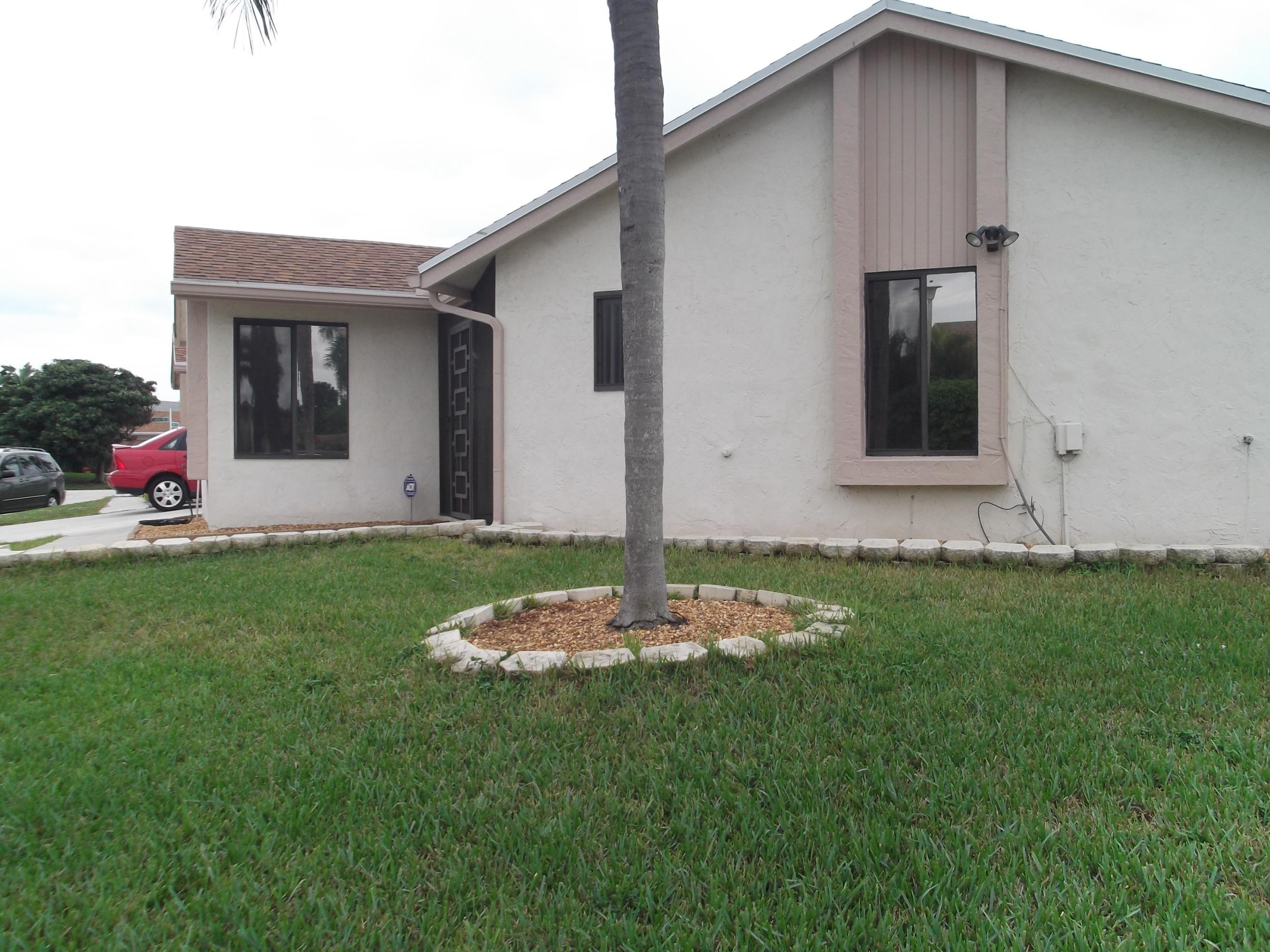 9665 Golf State Park Way Boca Raton, FL 33428 - Photo 21 of 22 a front view of house with yard