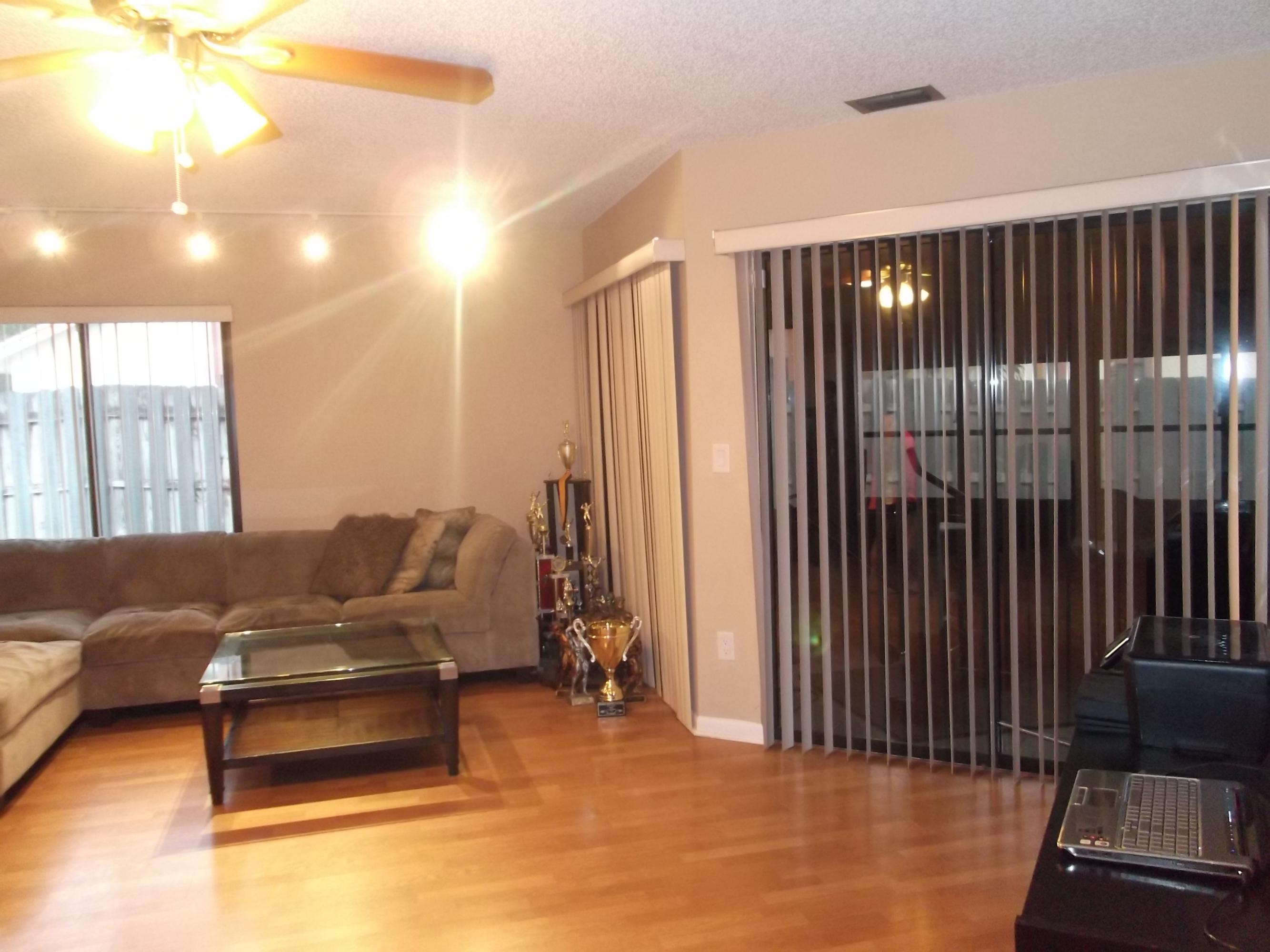 9665 Golf State Park Way Boca Raton, FL 33428 - Photo 3 of 22 a living room with furniture and a rug