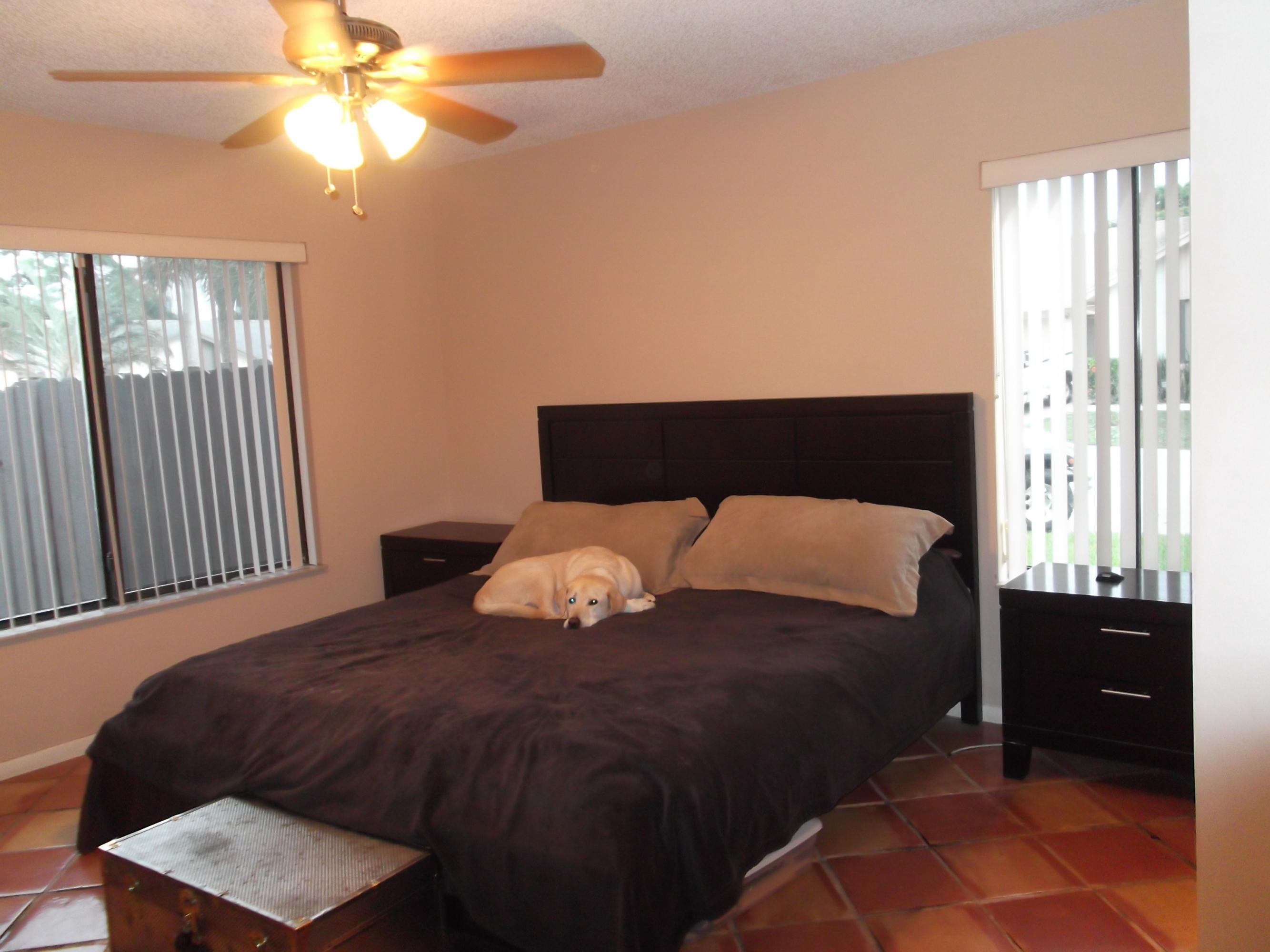 9665 Golf State Park Way Boca Raton, FL 33428 - Photo 8 of 22 a bedroom with a bed and a closet