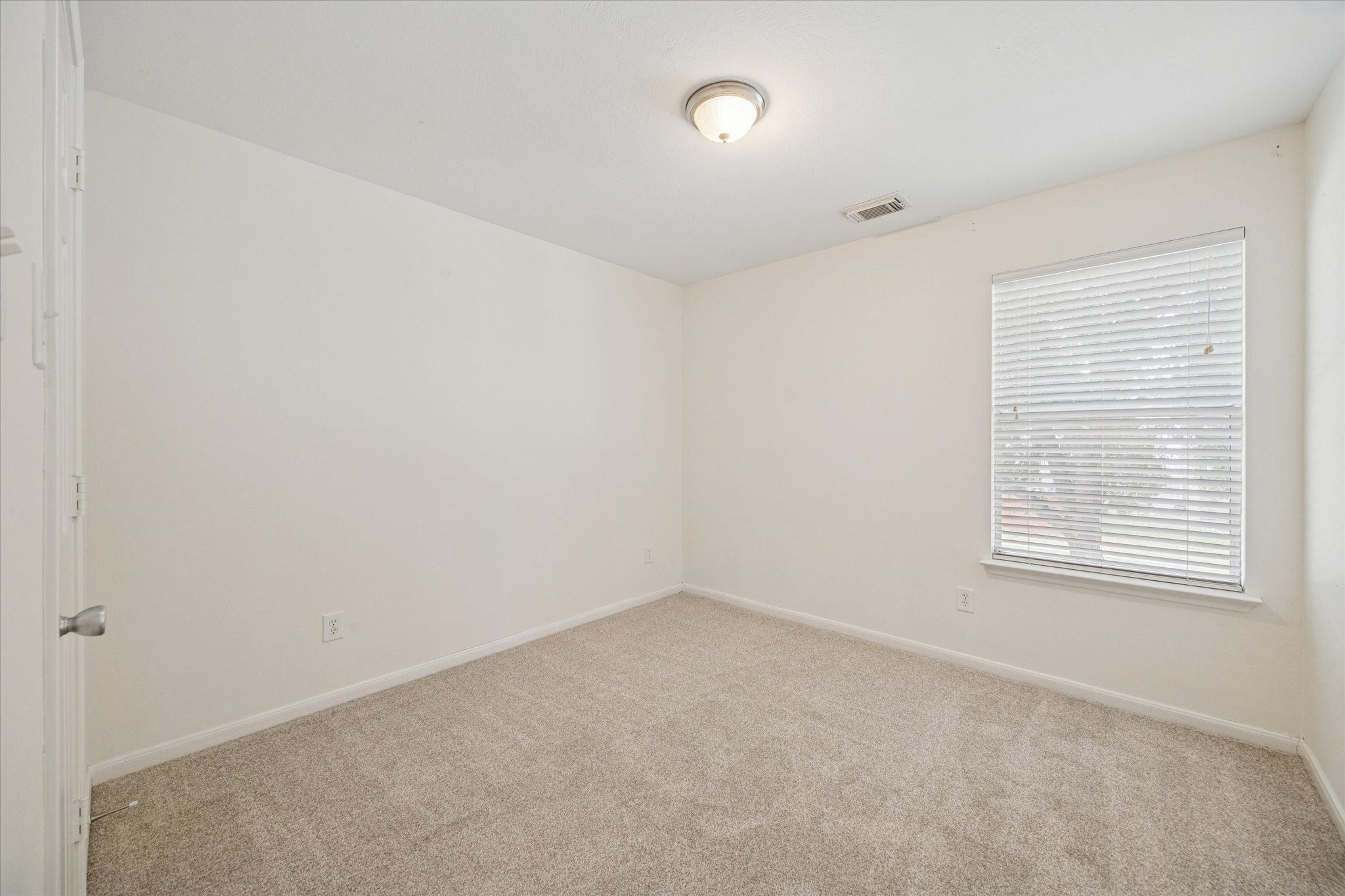 14102 Kinsbourne Lane Houston, TX 77014 - Photo 11 of 13 Third bedroom also has new carpet and pad, and walk-in closet.