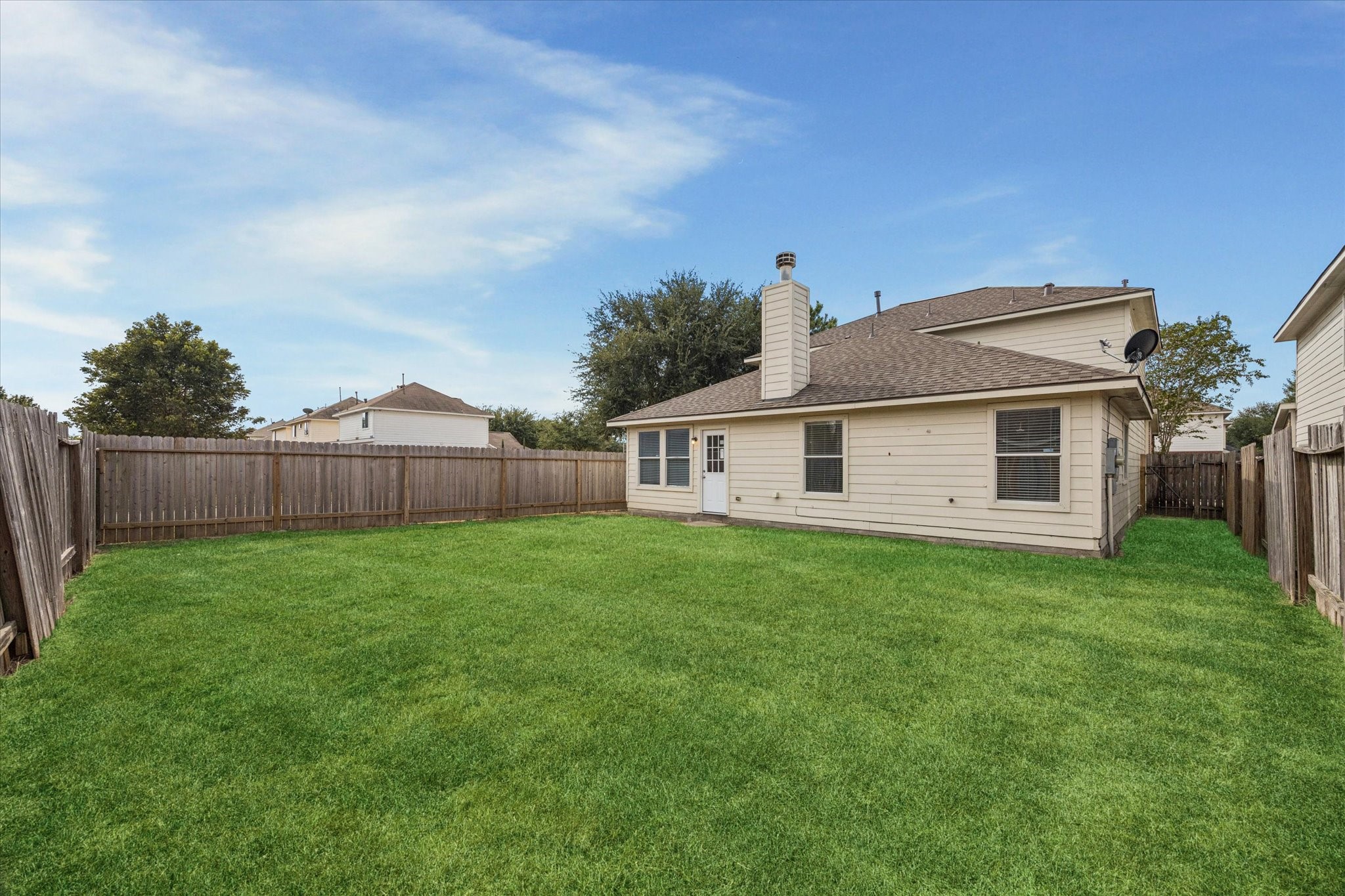 14102 Kinsbourne Lane Houston, TX 77014 - Photo 13 of 13 Great, fully fenced backyard is ready for your green thumb! Notice also the quality of the new roof.