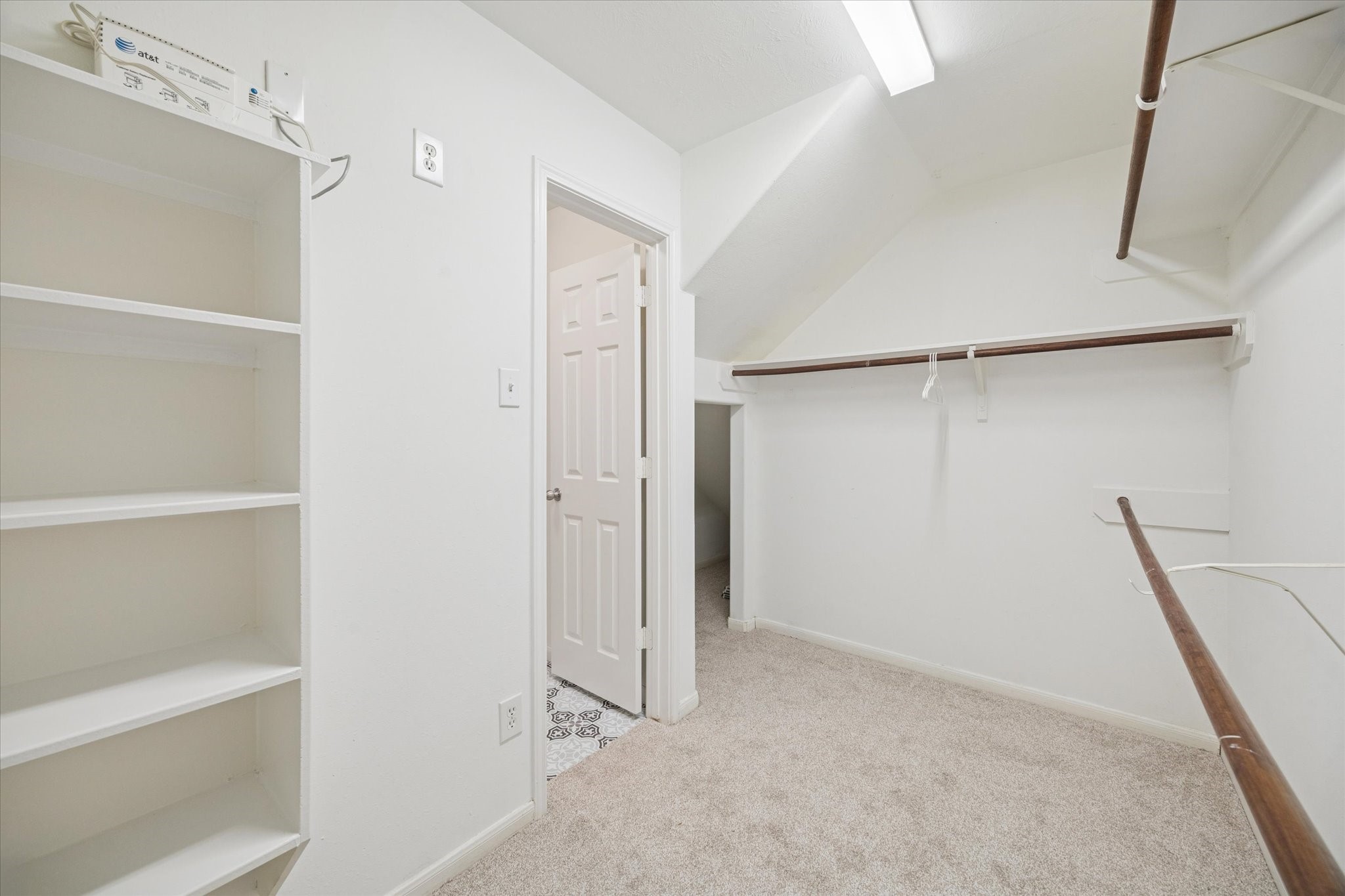 14102 Kinsbourne Lane Houston, TX 77014 - Photo 7 of 13 Shop 'till you drop! The primary walk-in closet is huge and continues under the stairs for even more storage.