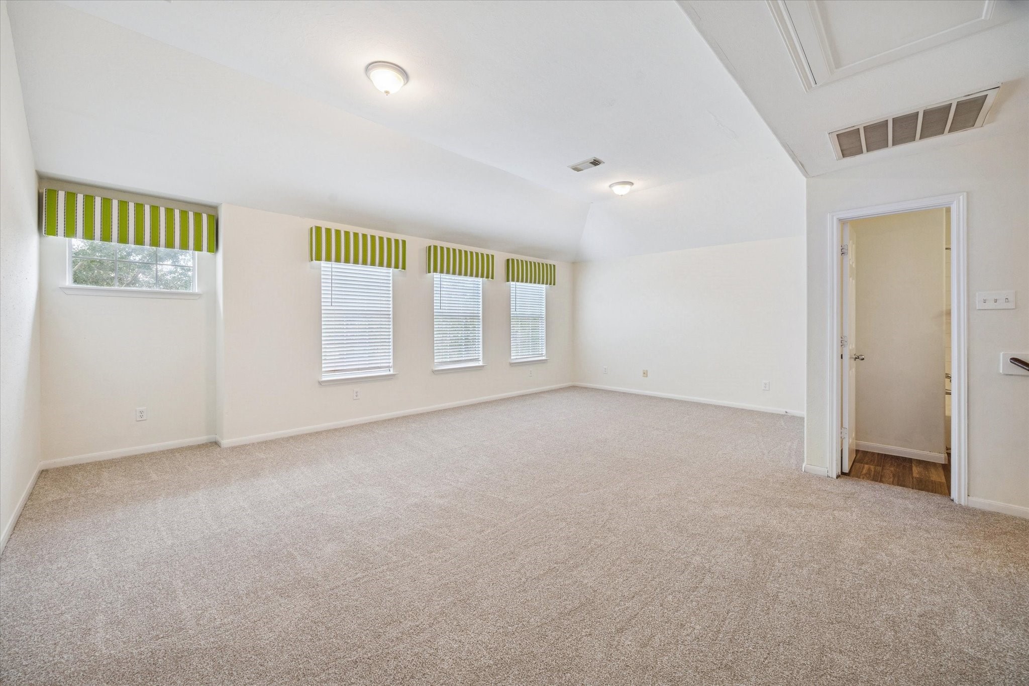 14102 Kinsbourne Lane Houston, TX 77014 - Photo 8 of 13 Upstairs is a great family retreat! Cheerful valances top the windows and plush new carpet and pad continue through the room and adjoining secondary bedrooms. Game room features a large closet with shelving for games, linens, etc and another smaller closet for hanging items.