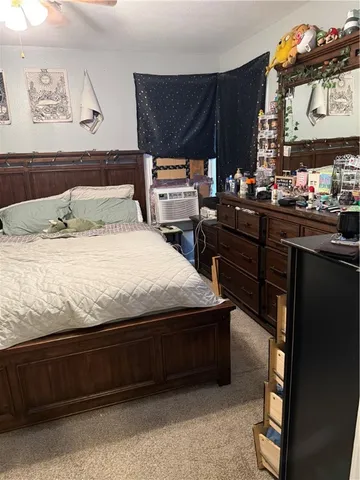 a bedroom with a bed and a closet