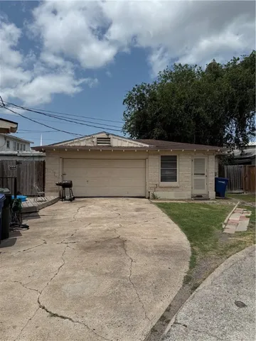 a view of a backyard of the house