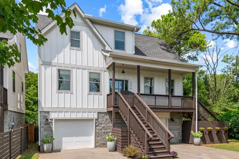 a front view of a house with many windows