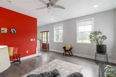 a living room with furniture and a window