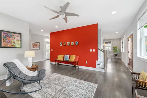 a view of a livingroom with furniture and wooden floor