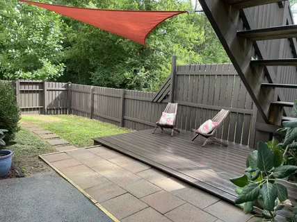 a view of a backyard with a deck