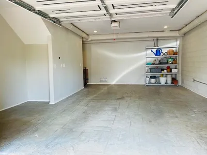 a view of a house with a tree in a yard