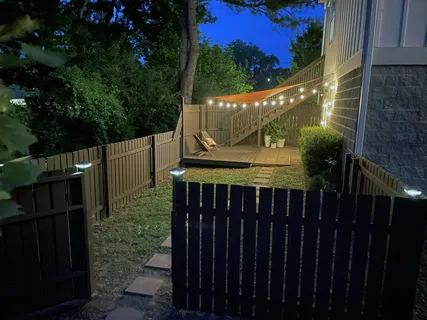 a lobby with a chair and potted plants