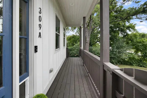 a view of a balcony with wooden floor