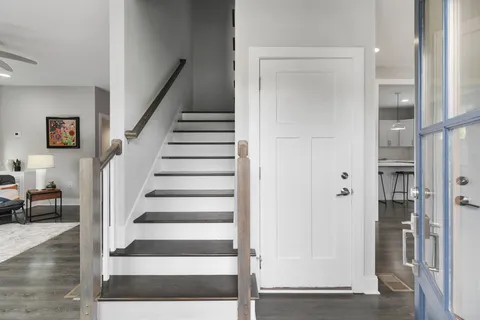 a view of entryway with wooden floor and windows