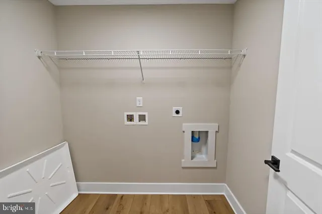 a view of room with hardwood floor and window