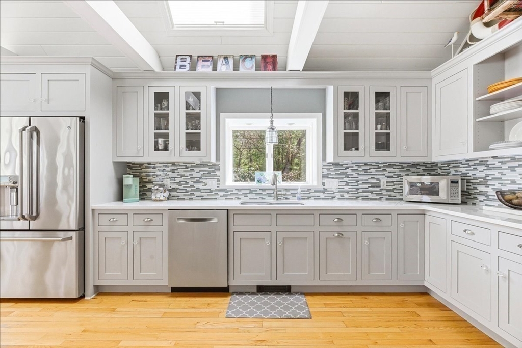 12 Salt Marsh Lane Wareham, MA 02571 - Photo 12 of 41 a large kitchen with granite countertop a sink and cabinets