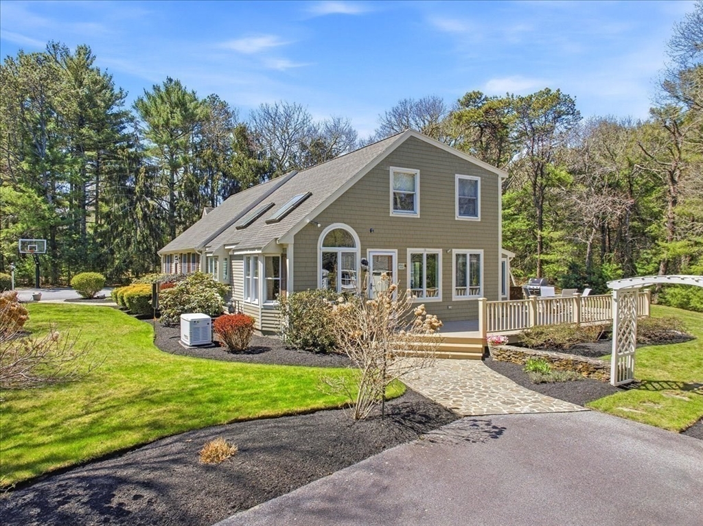 12 Salt Marsh Lane Wareham, MA 02571 - Photo 2 of 41 a front view of a house with garden