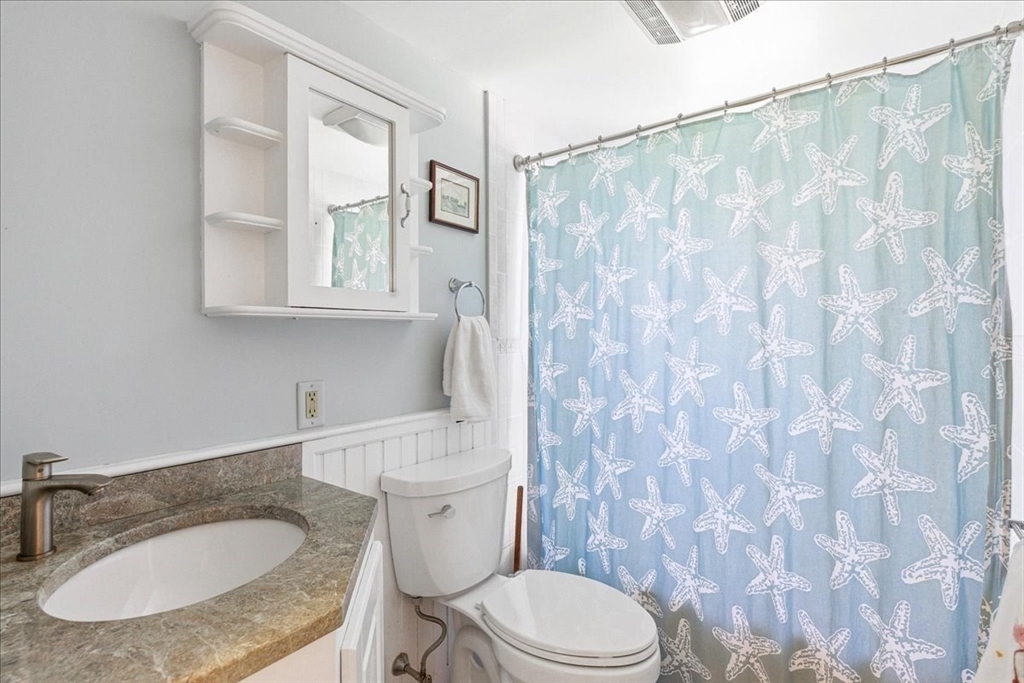 12 Salt Marsh Lane Wareham, MA 02571 - Photo 23 of 41 a bathroom with a granite countertop toilet sink and mirror