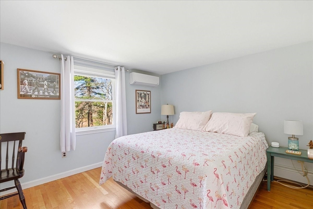 12 Salt Marsh Lane Wareham, MA 02571 - Photo 24 of 41 a bedroom with a bed and a window with chair