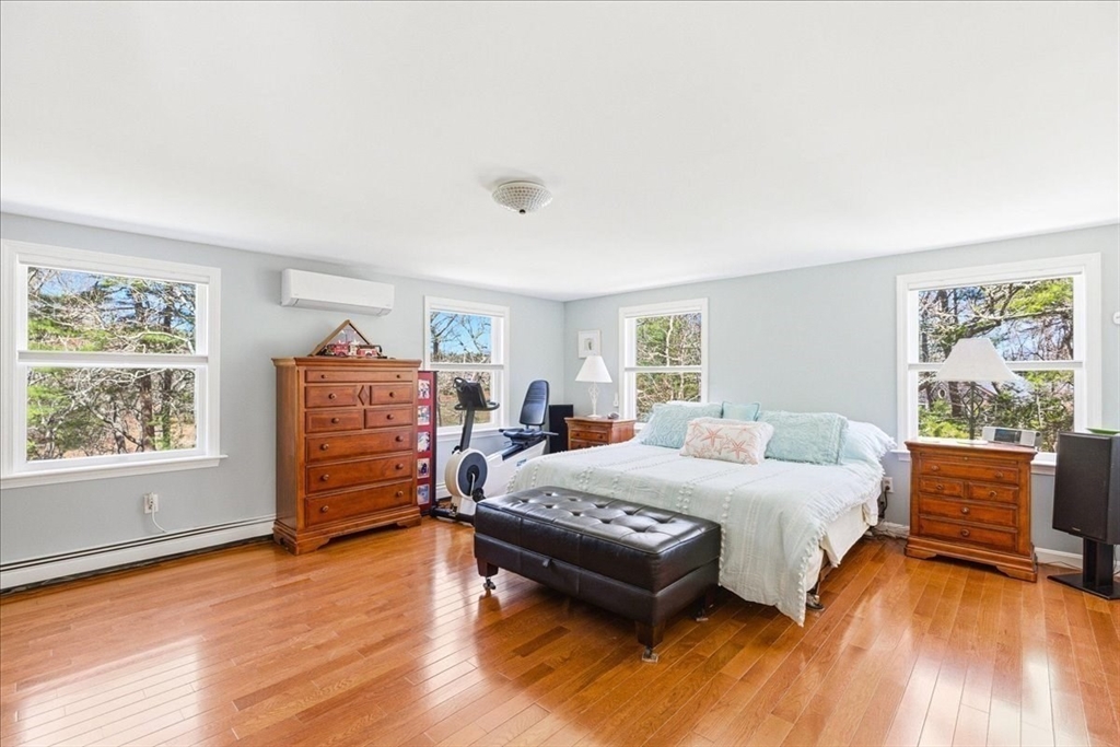 12 Salt Marsh Lane Wareham, MA 02571 - Photo 25 of 41 a bedroom with a bed and wooden floor