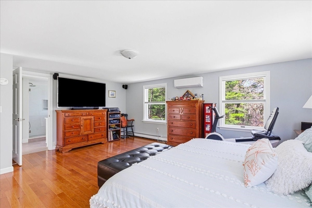 12 Salt Marsh Lane Wareham, MA 02571 - Photo 26 of 41 a bedroom with a bed and a flat screen tv