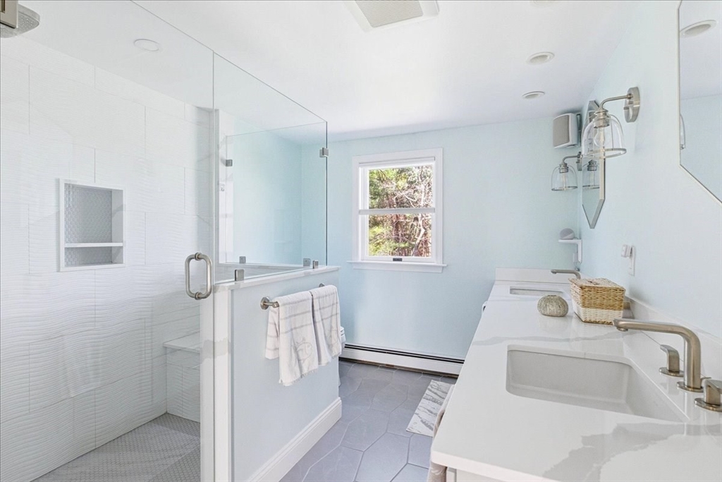 12 Salt Marsh Lane Wareham, MA 02571 - Photo 28 of 41 a bathroom with a sink a window and shower