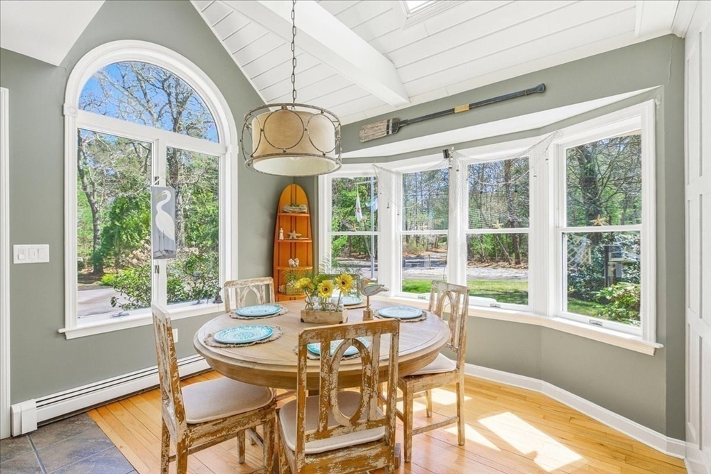 12 Salt Marsh Lane Wareham, MA 02571 - Photo 6 of 41 a view of a dining room with furniture wooden floor and chandelier