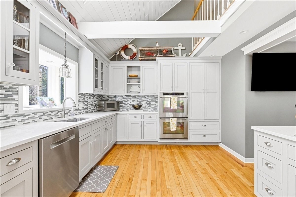 12 Salt Marsh Lane Wareham, MA 02571 - Photo 10 of 41 a kitchen with kitchen island a sink appliances and cabinets