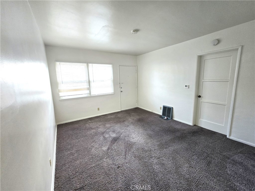 26027 Narbonne Avenue, Unit B Lomita, CA 90717 - Photo 3 of 11 an empty room with a window