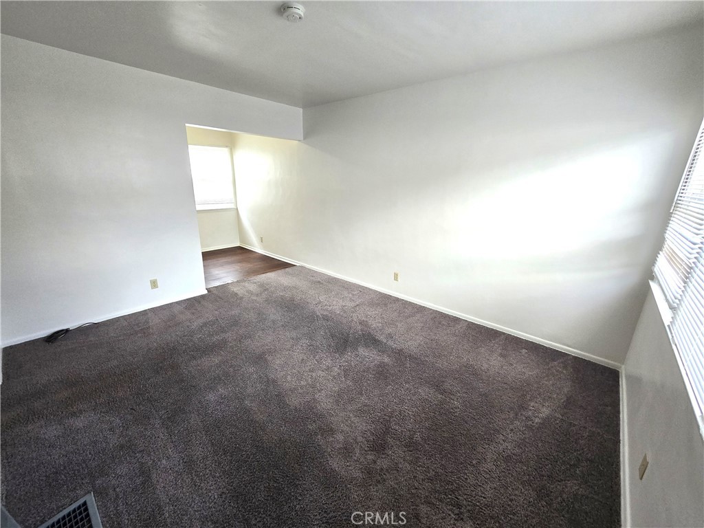 26027 Narbonne Avenue, Unit B Lomita, CA 90717 - Photo 5 of 11 an empty room with windows
