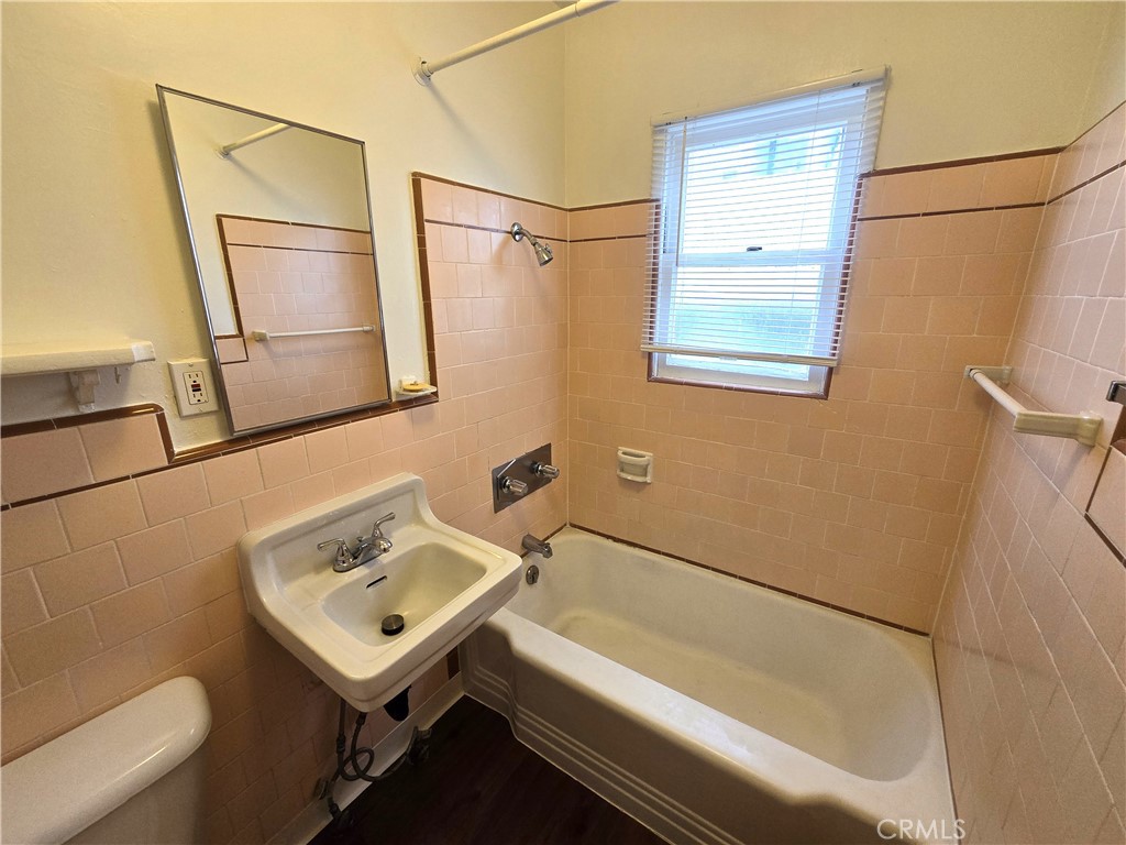 26027 Narbonne Avenue, Unit B Lomita, CA 90717 - Photo 9 of 11 a bathroom with a sink and a bathtub