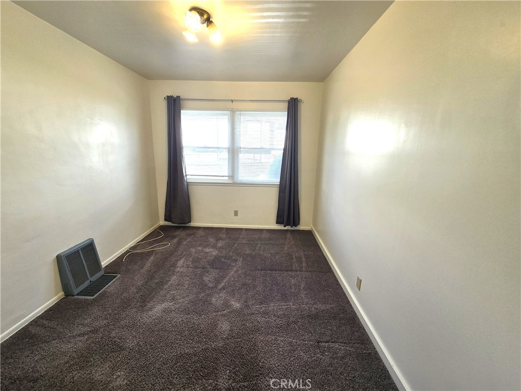26027 Narbonne Avenue, Unit B Lomita, CA 90717 - Photo 10 of 11 an empty room with windows