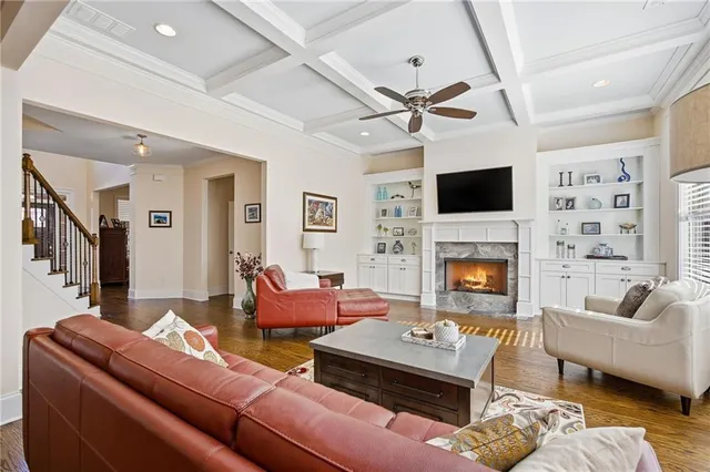 a living room with a fireplace and a flat screen tv