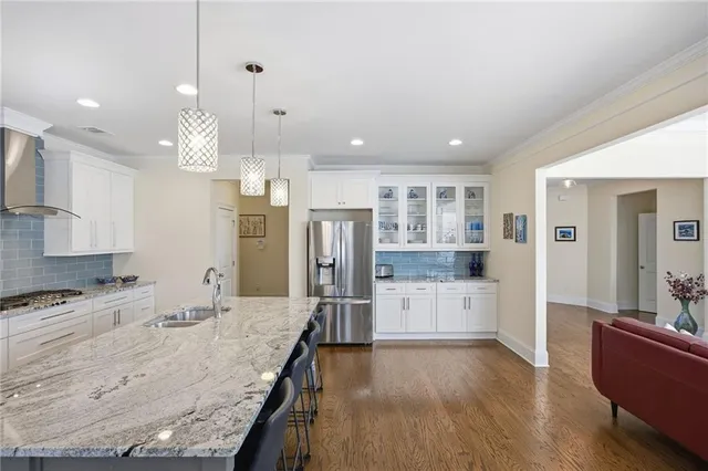 a dining room with furniture and wooden floor