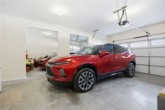 a spacious bedroom with a bed and a large window