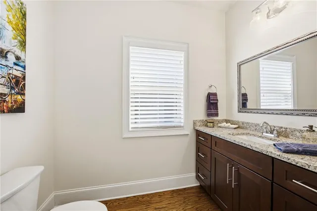 a bed room with a bed and a chair