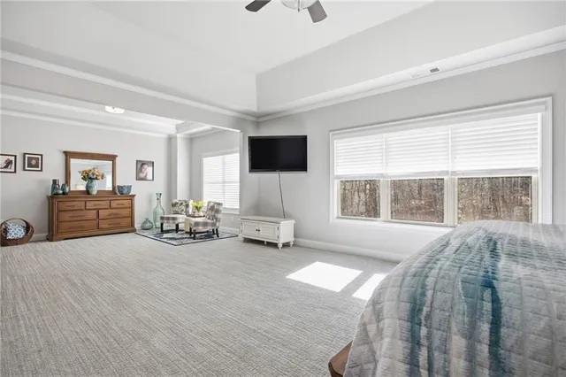 a view of walk in closet with clothes