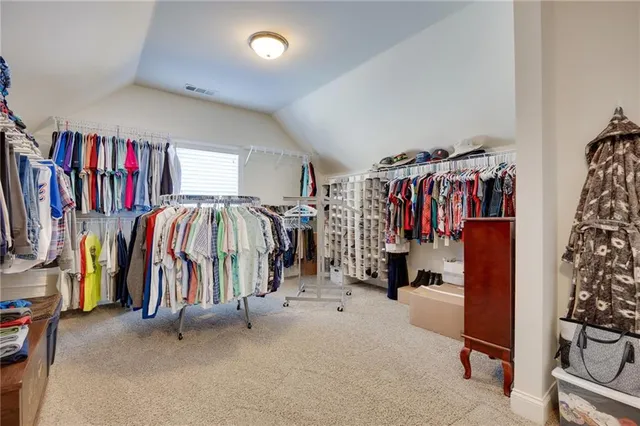 a utility room with granite countertop cabinets washer and dryer