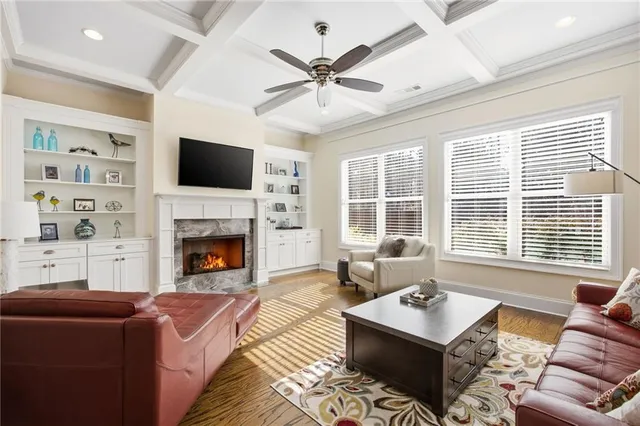 a living room with furniture fireplace and window