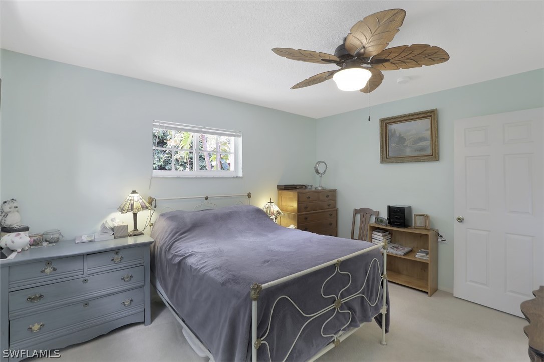 5807 Tarpon Road Bokeelia, FL 33922 - Photo 16 of 25 a bedroom with a bed and a window